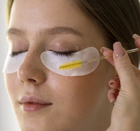 Side view woman wearing eye patches